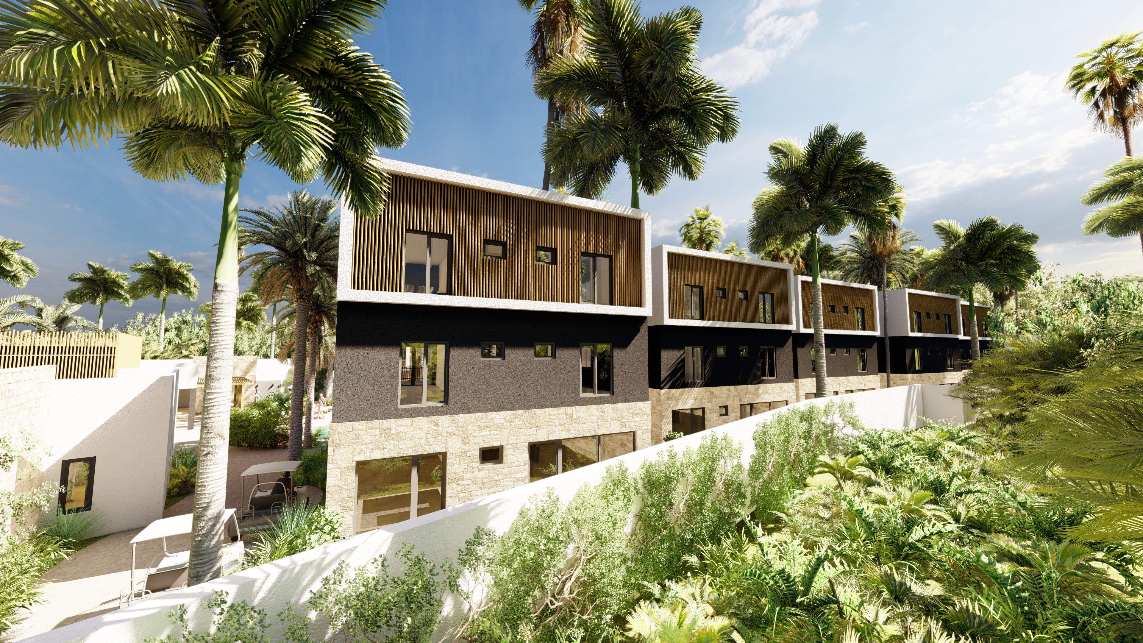 Townhouse-style residences with natural stone and timber cladding surrounded by tropical landscaping at Vela Paje
