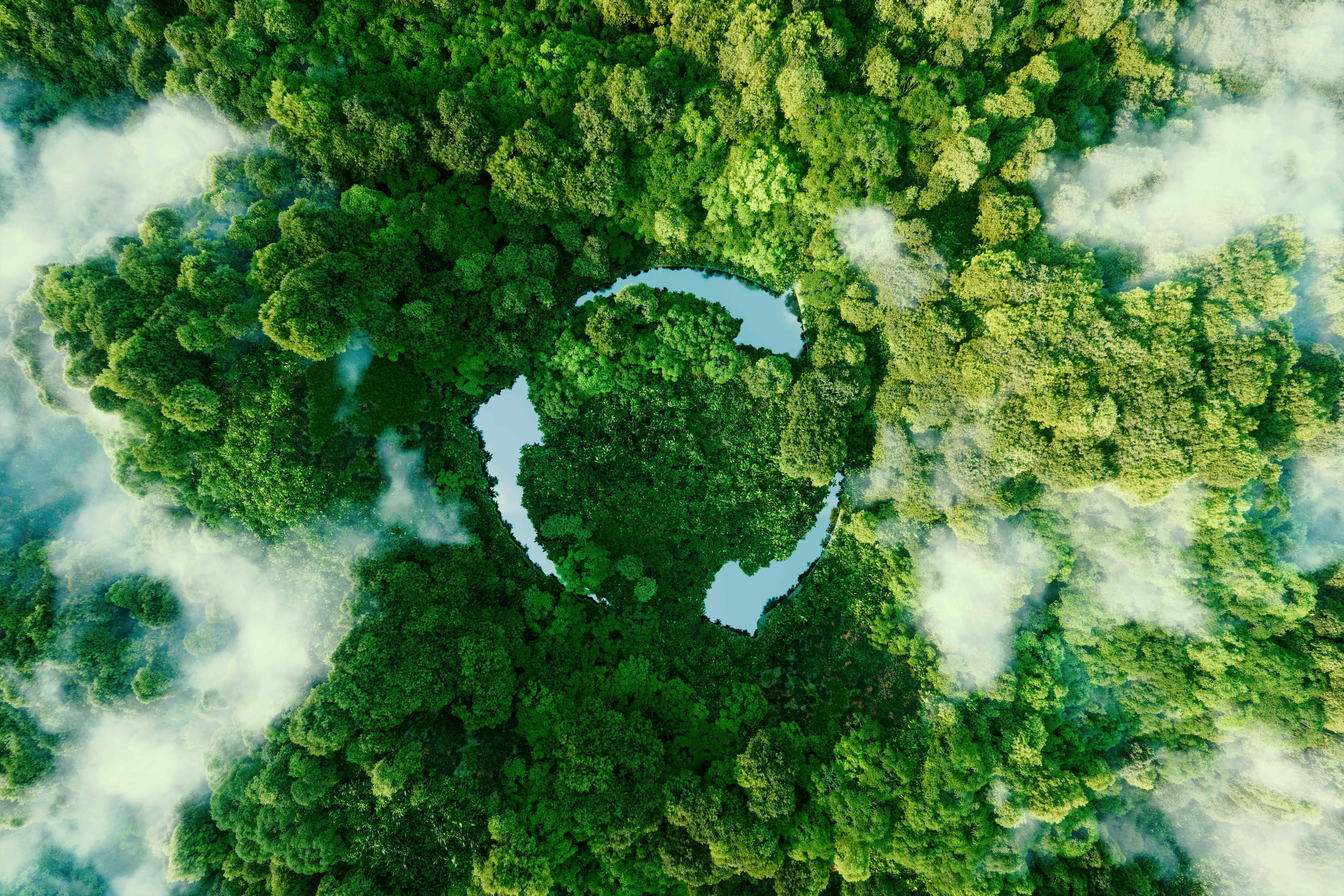 Aerial view of a recycling symbol formed by lakes in a tropical forest, representing sustainability