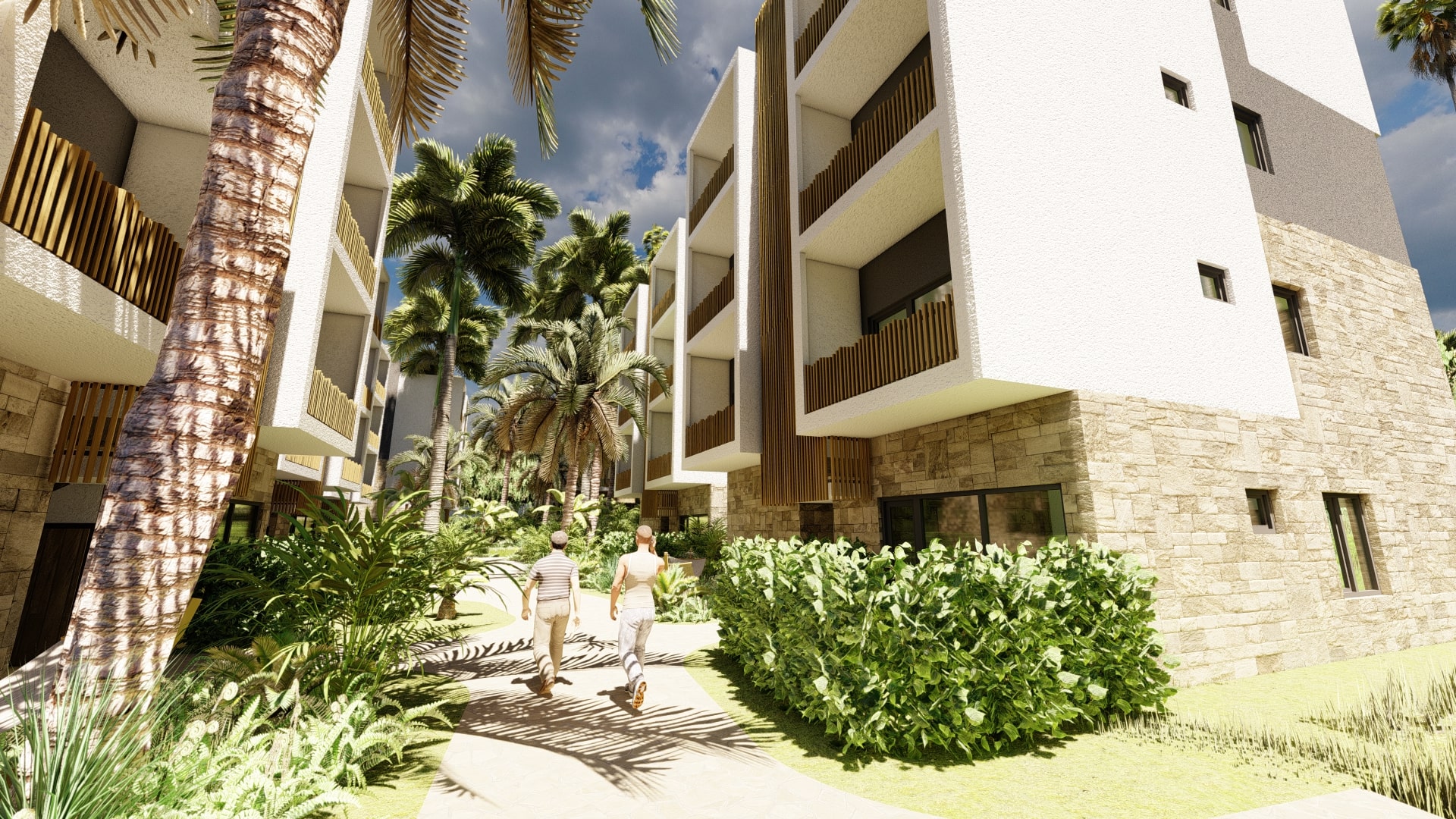 Open-air walkway between Vela Paje apartment buildings with tropical landscaping