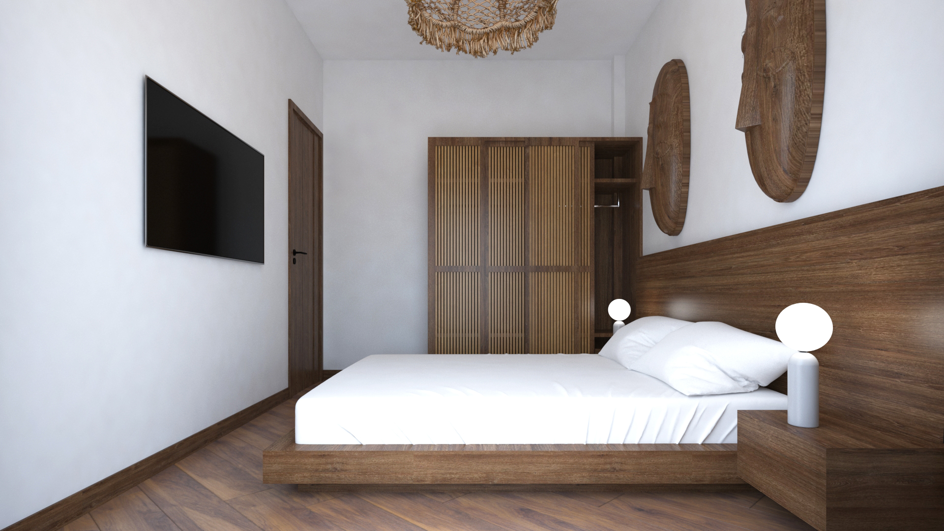 Second bedroom showing wall-mounted TV, slatted wood wardrobe, and platform bed with African mask wall art in Anga Apartment