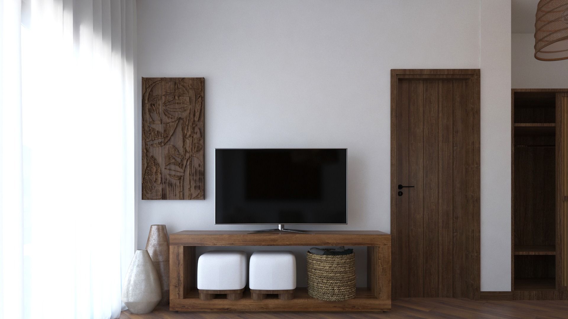 Entertainment area with flat-screen TV on wood media console and carved wall art in Anga Apartment