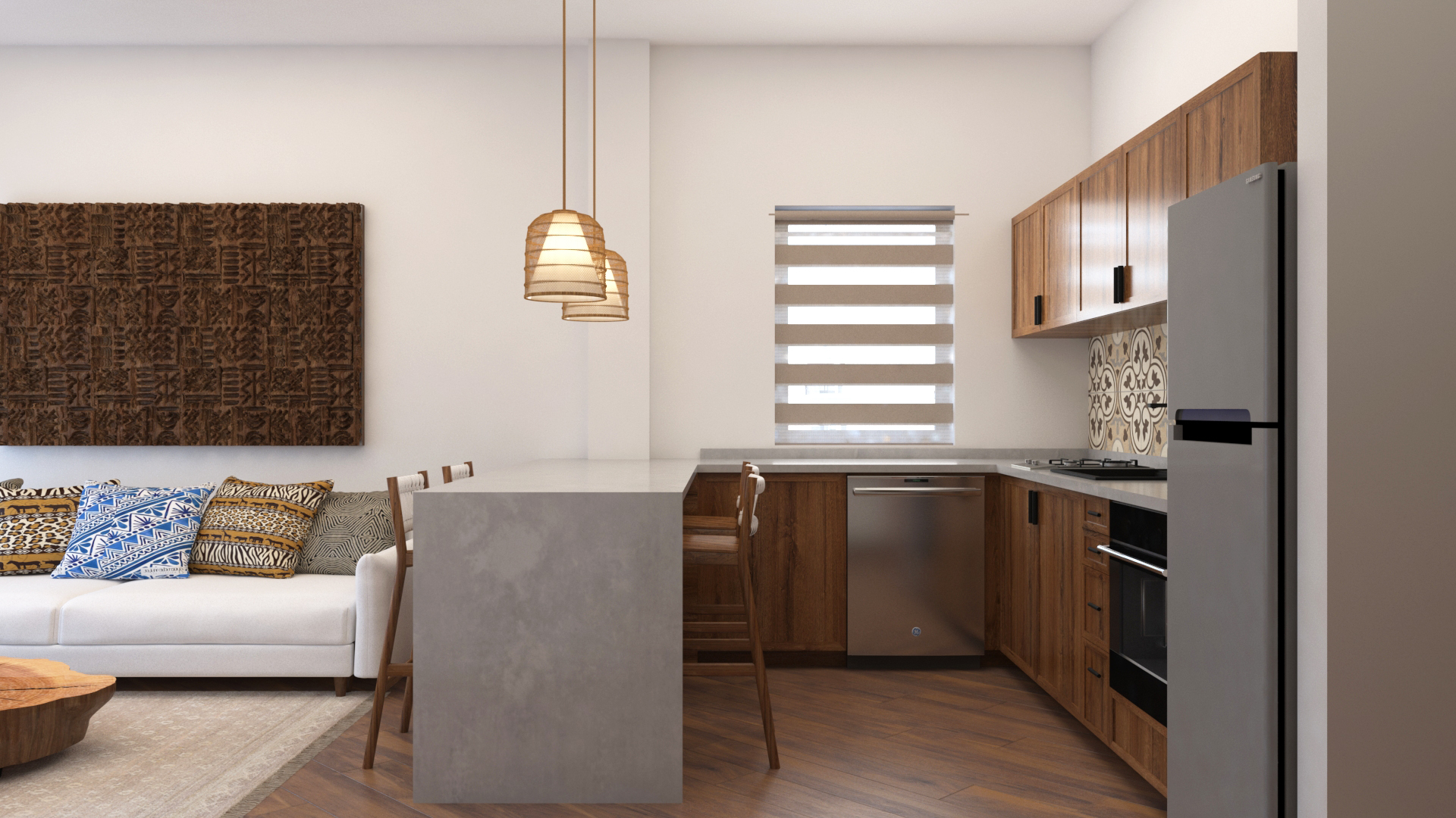 Open-plan kitchen with concrete island and view into living room in Upepo Apartment